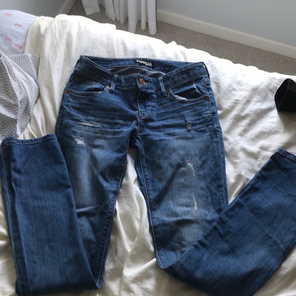 Lightly distressed low rise express jeans